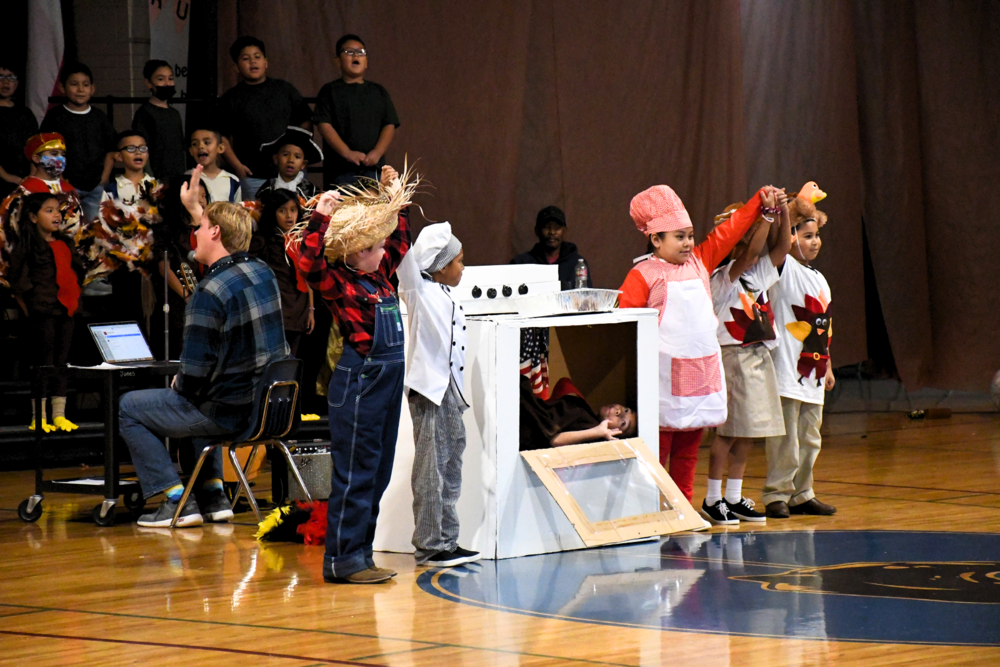 Jones Elementary students perform during the second grade program as chefs, a turkey and the farmer