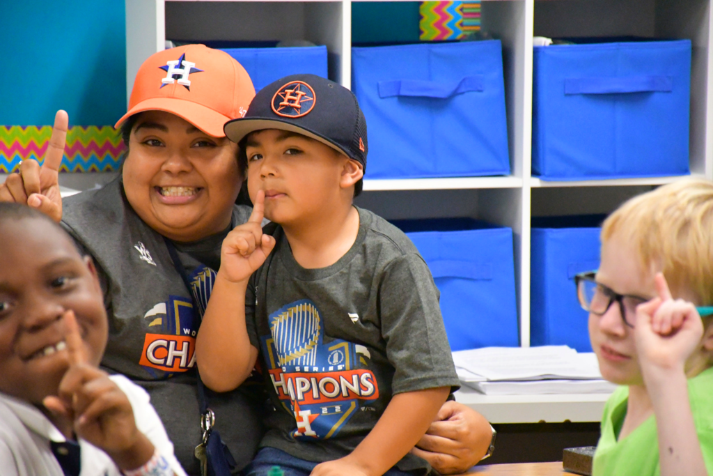 Mitchell Elementary third grade teacher Veronica Ostiguin celebrates the 2022 World Series Champion Houston Astros by wearing their team gear with her class and her nephew. 
