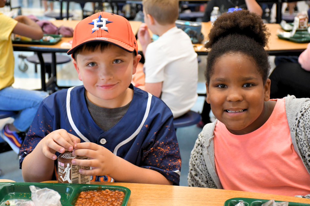 Mitchell Elementary students wear Houston Astros gear in the cafeteria to celebrate the team's World Series win.